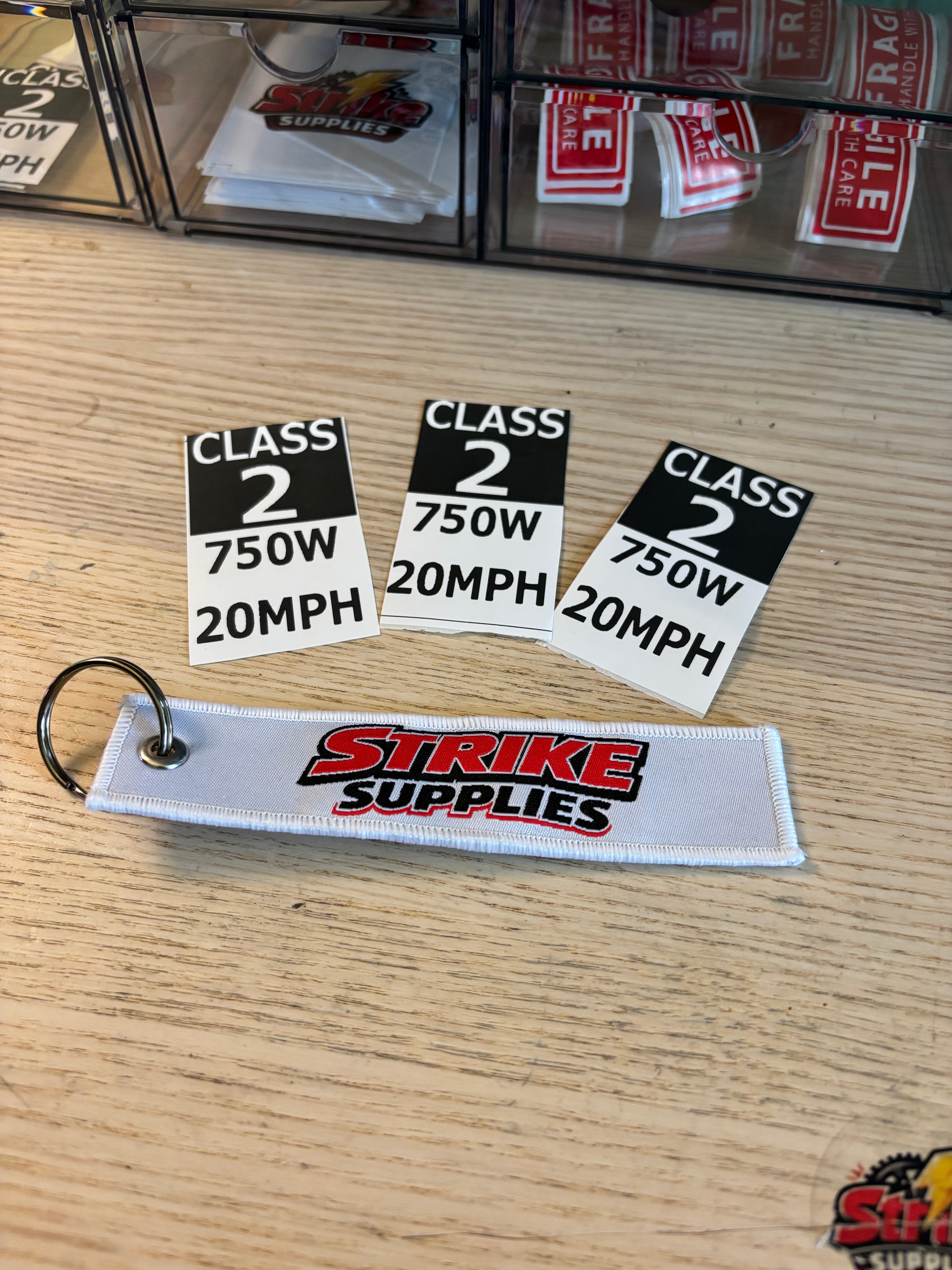 Class 2 stickers + keychain – Strike supplies